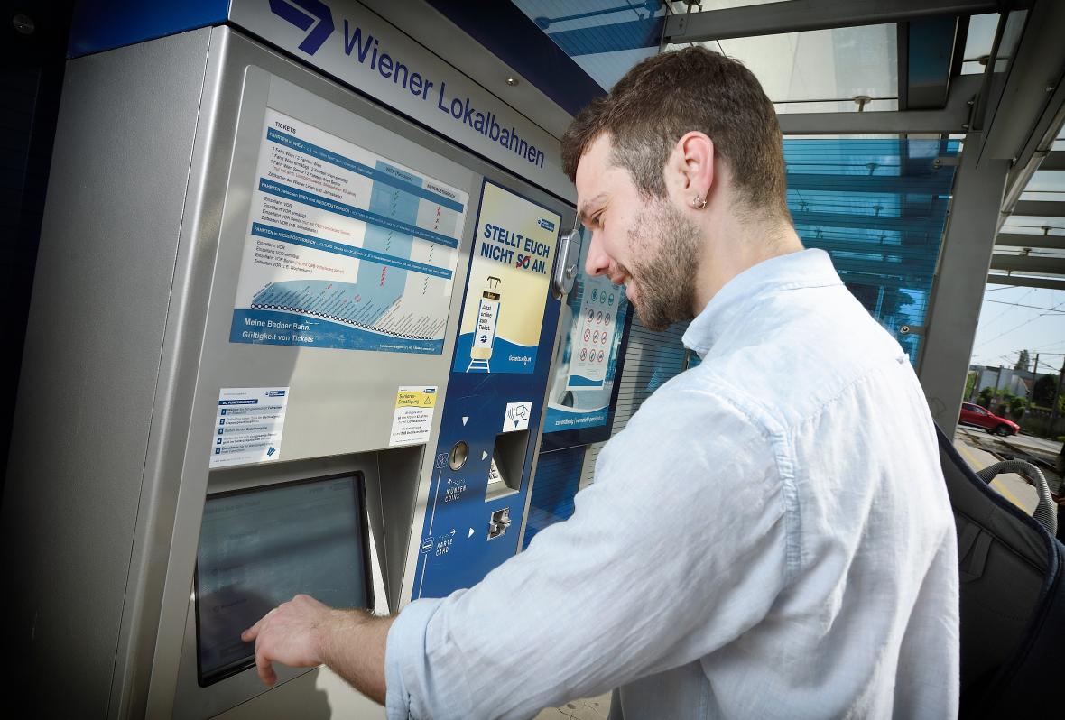 Passenger buying a ticket on a ticket machine